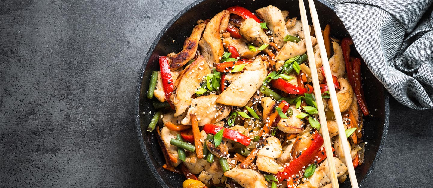 Chicken stir fry in a cast iron pan