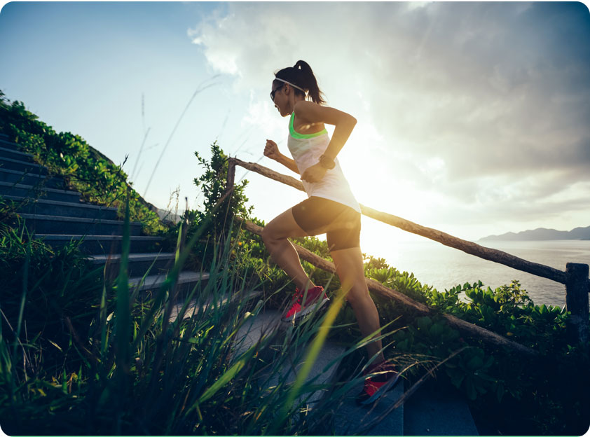 Woman running up staris